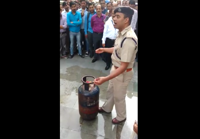 Watch the Video On How To Extinguish Fire In a Cylinder By Indian Police Officer